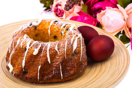 Easter cake and painted red eggs. Studio Photo