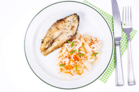 Fish fried, cabbage sauerkraut, lunch. Studio Photo