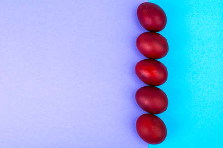 Easter red eggs on bright backgroundの写真素材