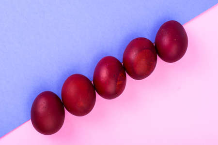 Easter red eggs on bright backgroundの写真素材