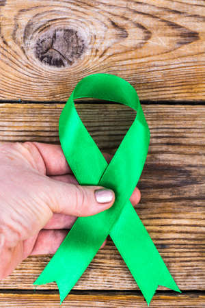 Green ribbon as symbol of awareness of the disease, World Health Dayの写真素材
