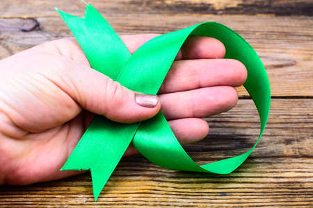 Green ribbon as symbol of awareness of the disease, World Health Dayの写真素材