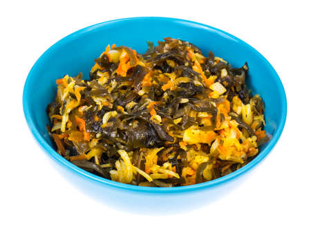 Vegetable salad with sea kale in blue bowlの写真素材