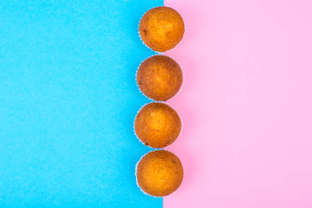 Row of mini cupcakes on bright backgroundの写真素材