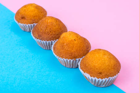 Row of mini cupcakes on bright backgroundの写真素材