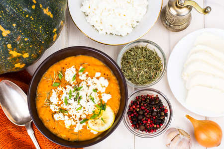 Pumpkin cream soup with goat cheeseの写真素材