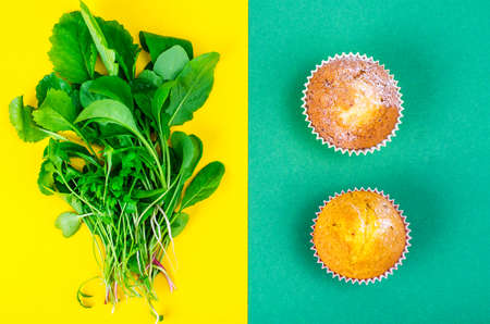 Concept of healthy eating, choice of salad or cupcakesの写真素材