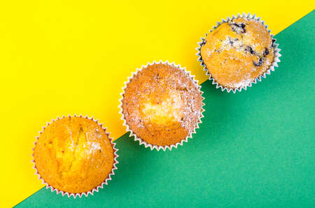 Tasty fresh cupcakes on bright backgroundの写真素材