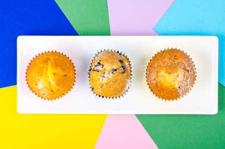Tasty fresh cupcakes on bright backgroundの写真素材