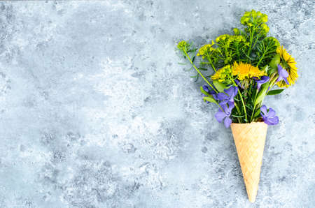 Creative layout and composition of waffle cone and garden flowers. Top view
の写真素材