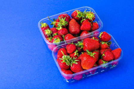 Plastic container with fresh strawberriesの写真素材