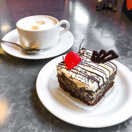 Sweet cake, dessert with cream and poppy seeds, coffee
