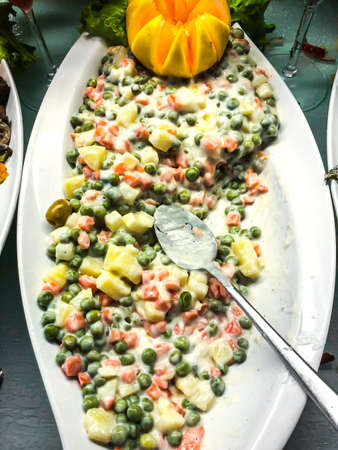 Potato salad with carrots and green peas. Studio Photoの写真素材