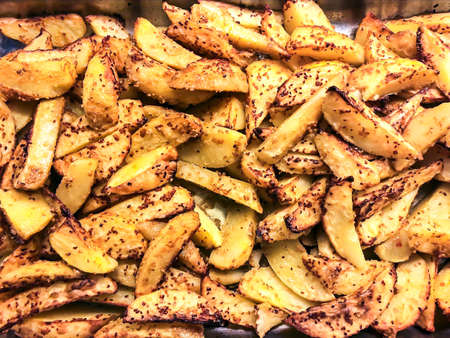 Potato slices baked with spices. Studio Photoの写真素材