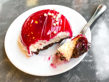 Mousse cake with red mirror glaze