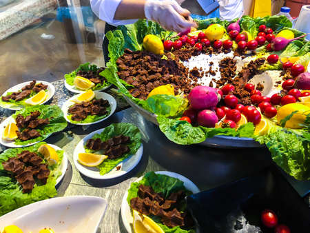 Spicy beef in Turkish with vegetables and lemon