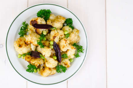 Vegetarian dish with cauliflower and peasの写真素材
