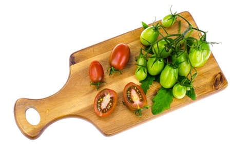 Branch of green unripe cherry tomatoes.の写真素材