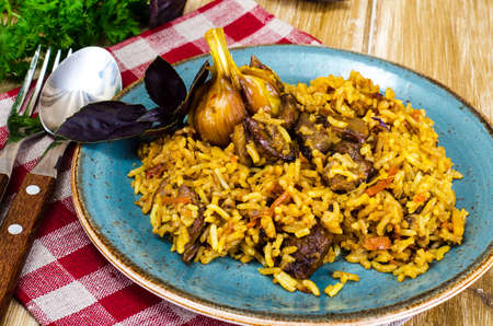 Blue plate with pilaf and meat. Studio Photoの写真素材
