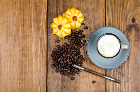 Coffee in cup, biscuits, beansの写真素材