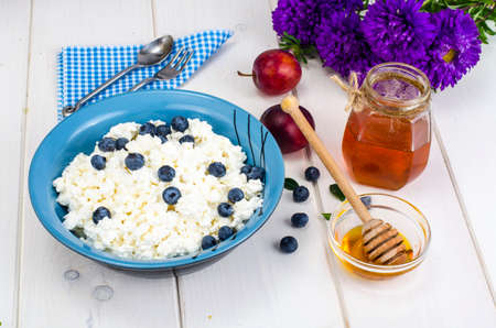 Dairy products in dietary foods. Cottage cheese with fresh berries and honeyの写真素材