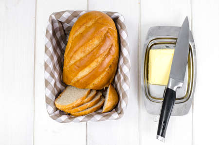 Fresh homemade wheat bread and butterの写真素材