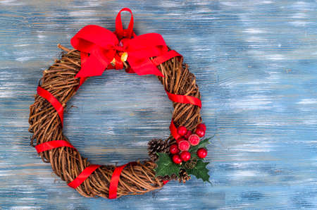 Handmade Christmas wreath on blue backgroundの写真素材