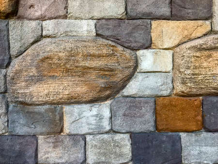 Decorative wall of colored stone bricksの写真素材