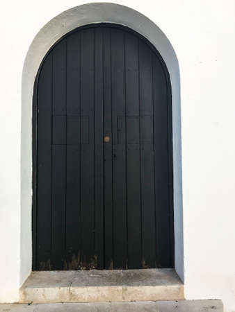 Wooden vintage doors in wall of an old buildingの写真素材