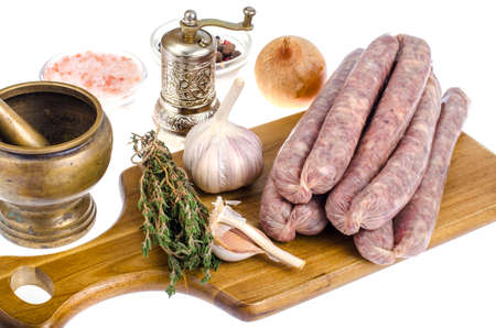 Raw homemade sausage in natural casing, spices, herbs for cooking. Studio Photoの写真素材