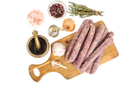 Raw homemade sausage in natural casing, spices, herbs for cooking. Studio Photoの写真素材