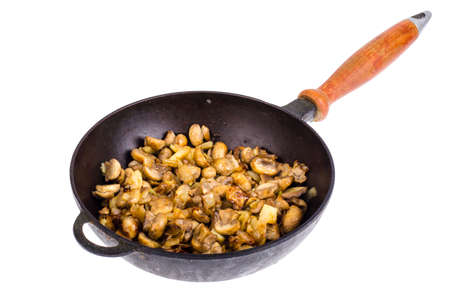 Cast iron pan, fried champignons with onions. Studio Photoの写真素材