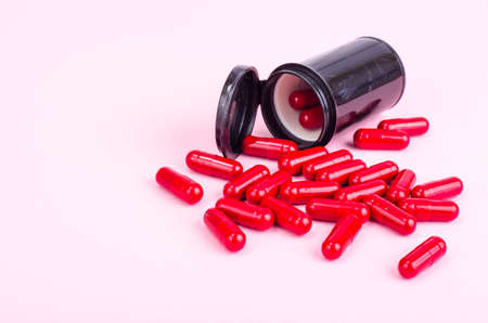 Medicine concept. Scattered capsules from prescription bottle. Studio Photoの写真素材