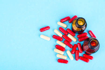 Medicine concept. Scattered capsules from prescription bottle. Studio Photoの写真素材