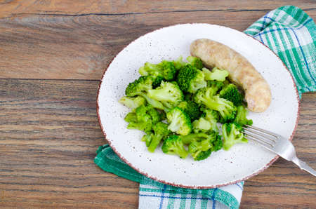 Boiled broccoli with sausage.の写真素材