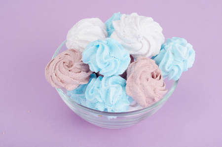 Meringue colored sugar air tasty. Studio Photo