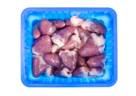 Chicken liver in plastic packaging isolated on white background. Studio Photo