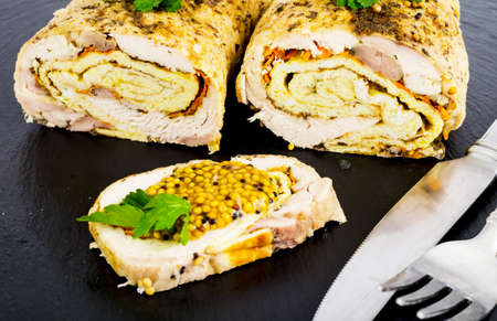 Chicken meat rolls with egg pancakes and carrots. Studio Photo