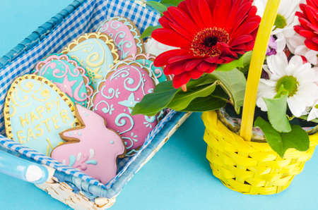 Beautiful bouquet of flowers and homemade gingerbread for celebration of Easter. Studio Photoの写真素材