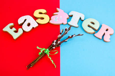 Bright Easter background.  Decoration eggs and colorful letters forming words  EASTER. Celebration...