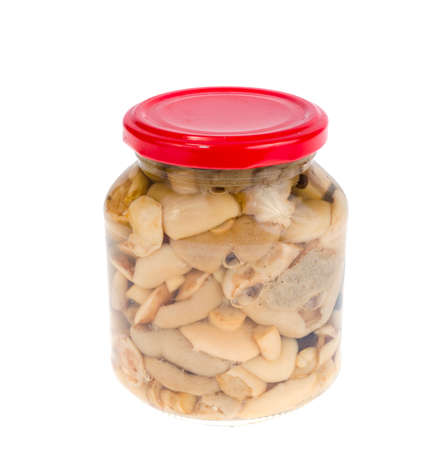 Glass jar of pickled mushrooms isolated on white background. Studio Photoの写真素材