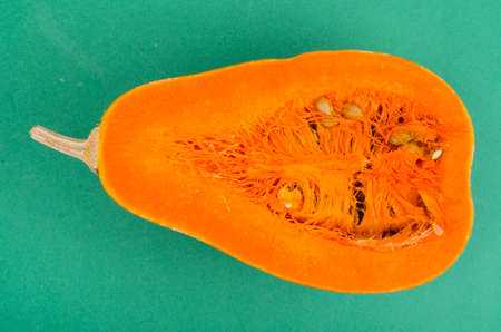 Fresh orange cut in half Cucurbita moschata. Studio Photoの写真素材