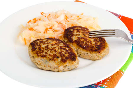 Pickled cabbage with cutlets oa white plate