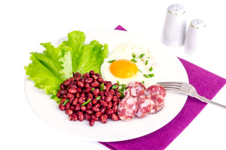 Red beans, lettuce and fried egg for breakfast.の写真素材