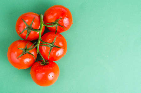 Creative layout of tomatoes on bright background.の写真素材