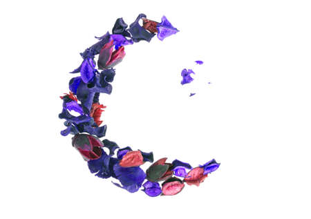 Creative flower composition in form of crescent of dry flowers and petals, green leaves. Top view, flat lay. Studio Photoの写真素材