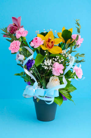 Mix of luxurious flowers in pot.の写真素材