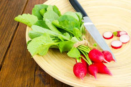Fresh farmer bio radish on wooden plate.の写真素材