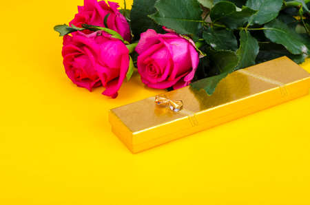 Beautiful bouquet of roses and gift box for holidayの写真素材