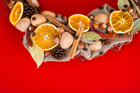 Christmas wreath element on red background.の写真素材